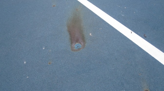 Rust spot on tennis court